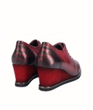 Leather wedge shoe combined with metallic burgundy snake engraved leather with elastic