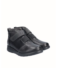 Flat black leather ankle boots with elastic and velcro closure