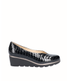 Black snake engraved patent leather wedge shoe