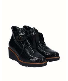Black embossed leather wedge ankle boots