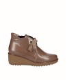 Brown patent leather wedge...