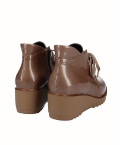 Brown patent leather wedge ankle boot