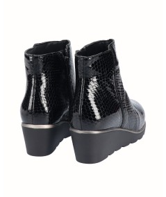 Black snake engraved patent leather wedge ankle boots